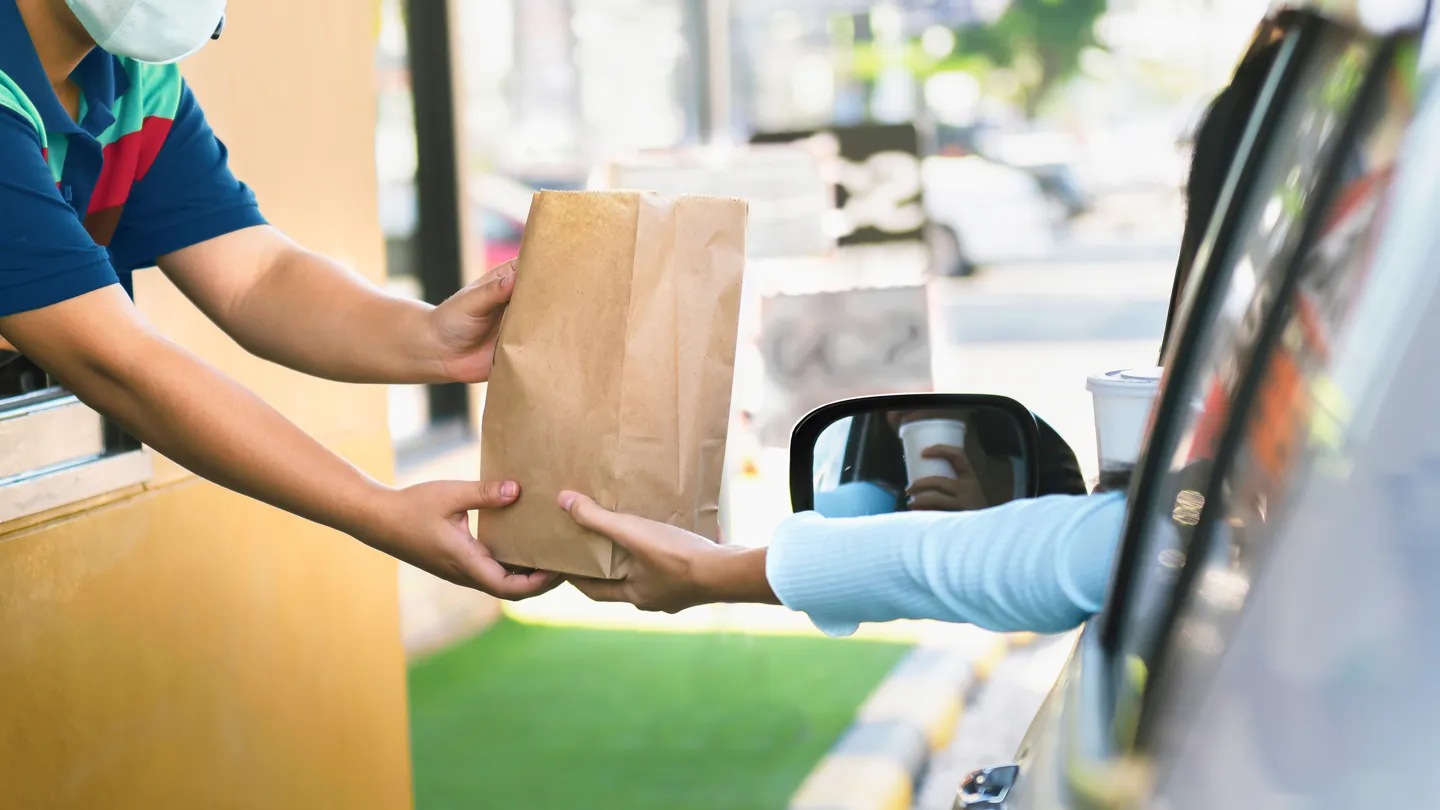Adult with type 2 diabetes ordering fast food