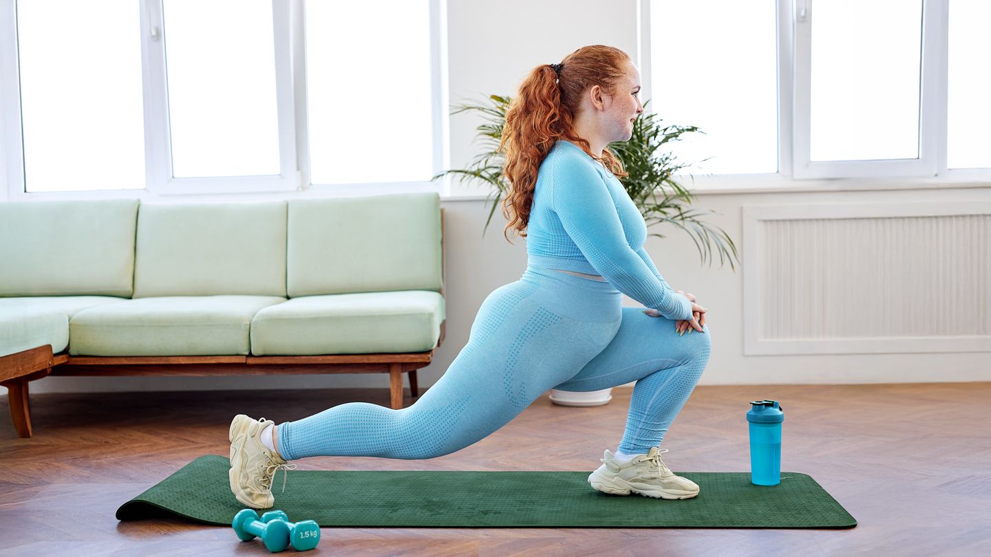 Young plus size woman exercising in the morning