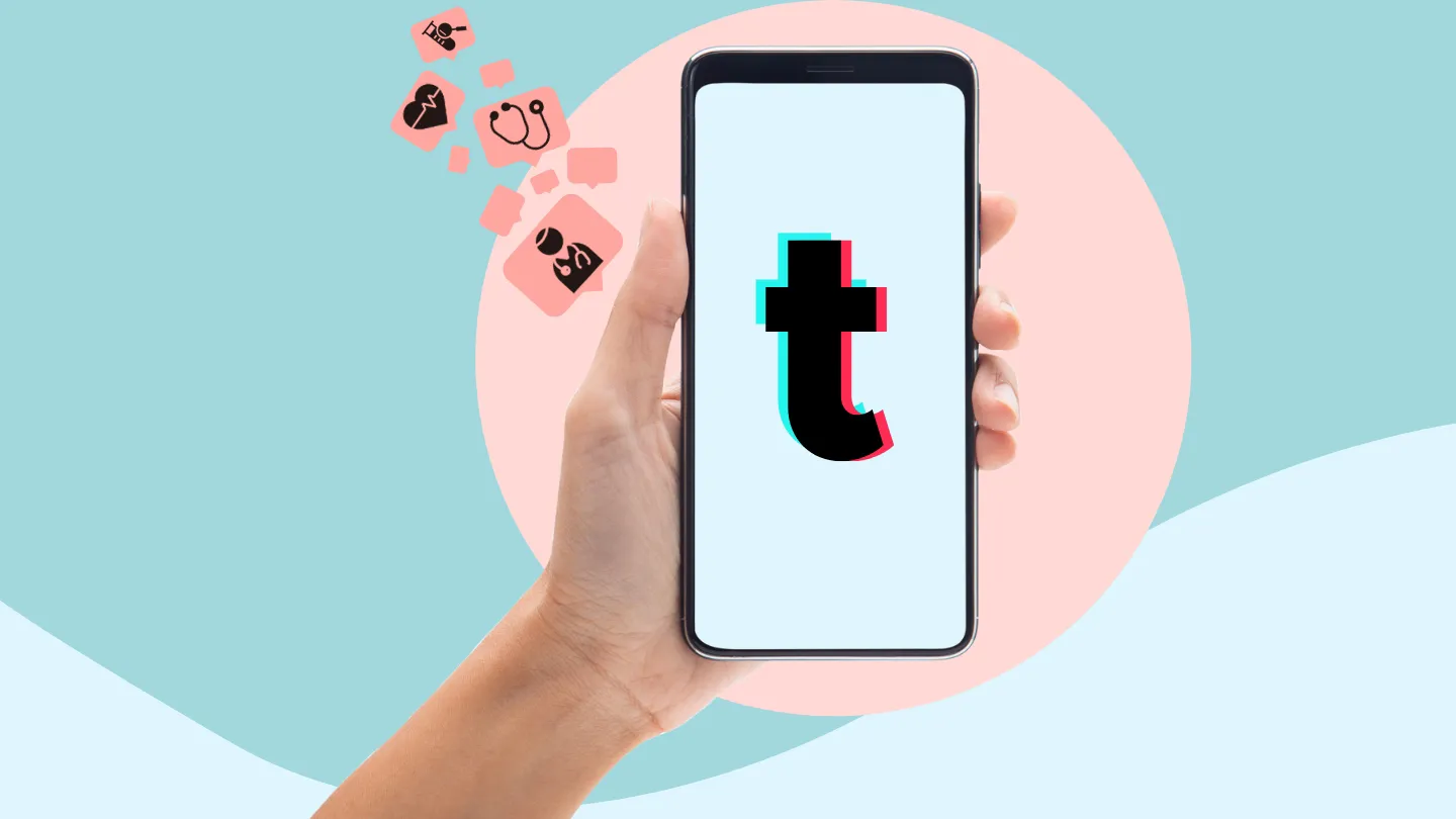 Hand holding phone with tiktok logo on screen for medical advice