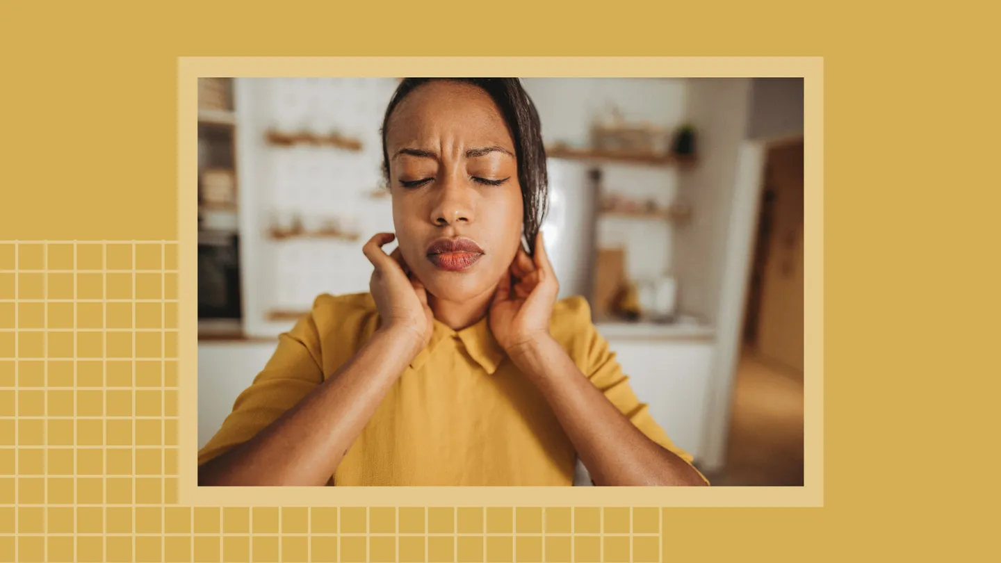 black woman holding her neck in pain