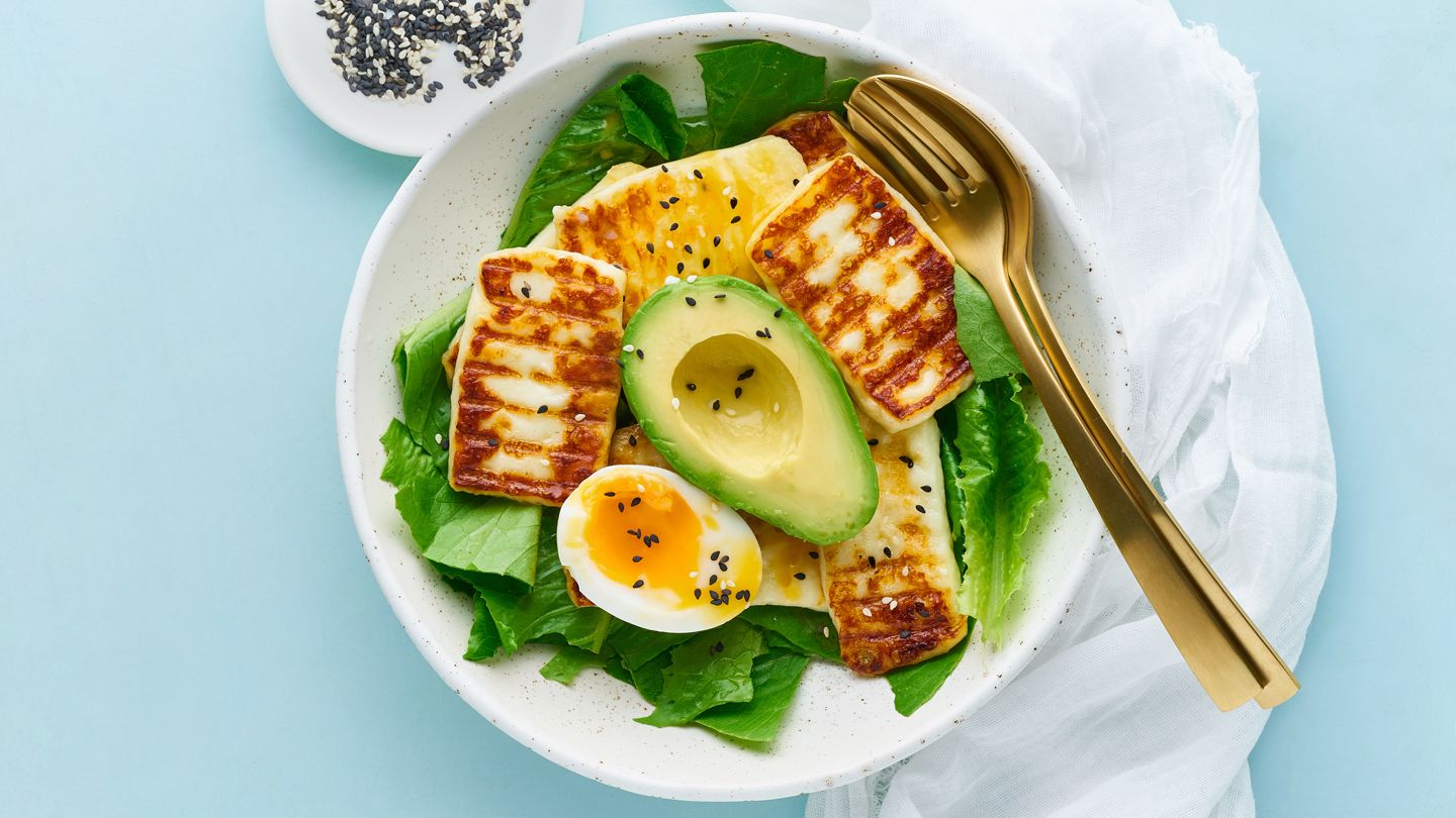 keto ketogenic diet soft boiled eggs with avocado halloumi cheese and lettuce