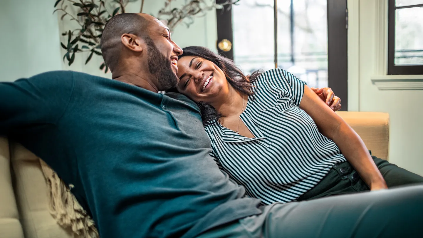 mature couple being romantic in living room
