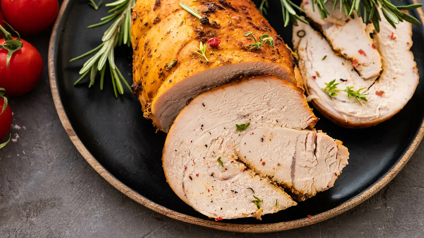 herb roasted turkey sliced on a plate