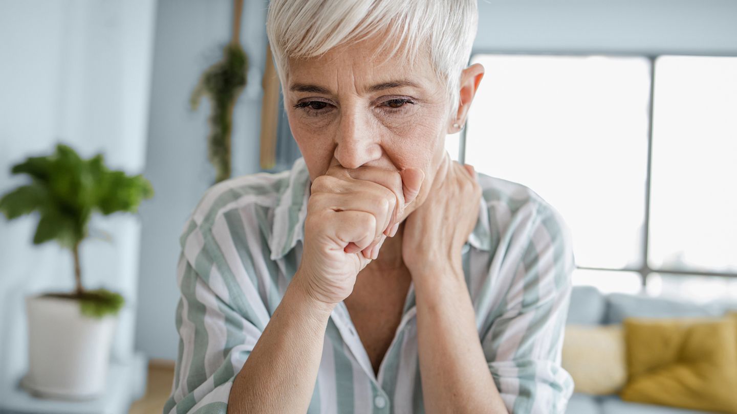 mature woman coughing