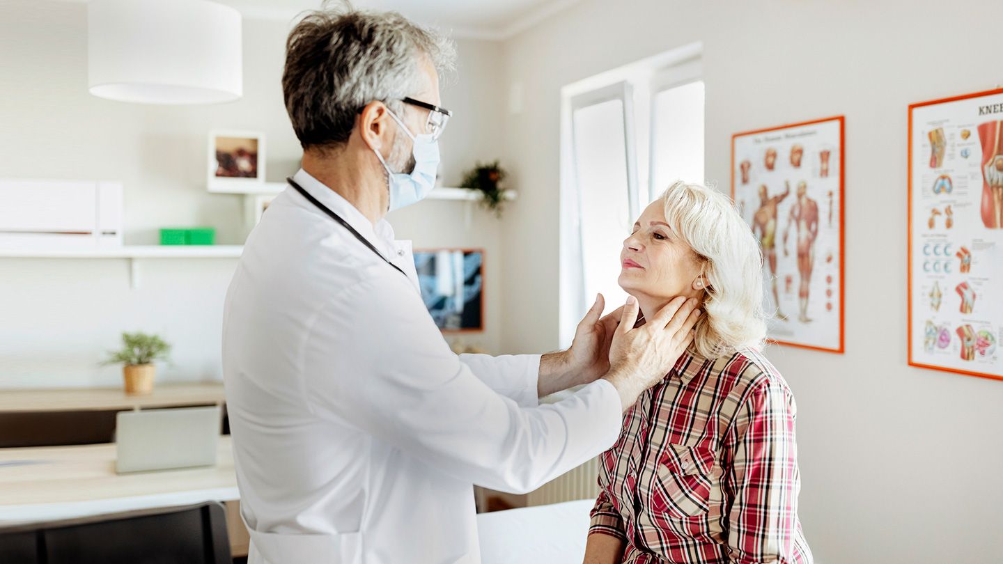 doctor examining glands