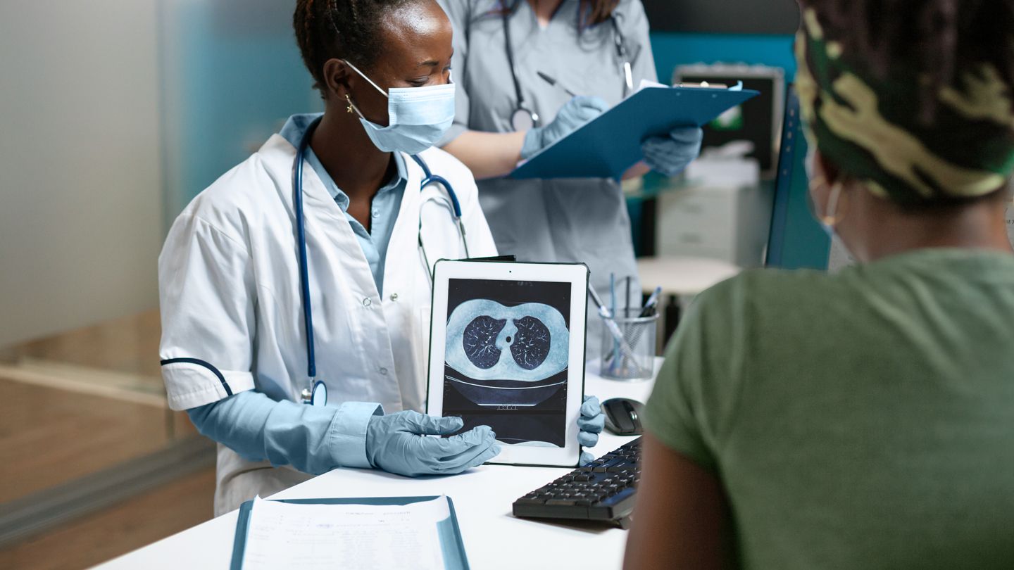 Black female patient discussing lung imaging results