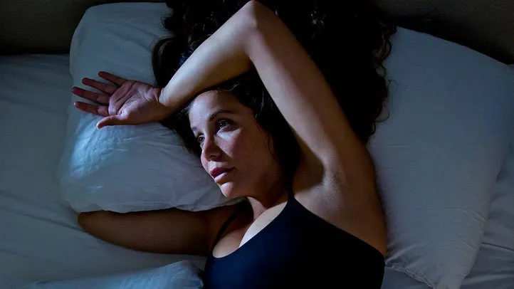 a woman with night sweats