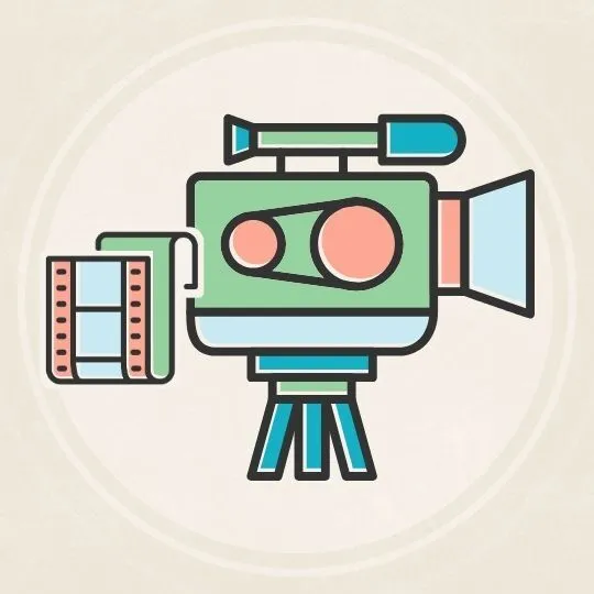 Film camera colored blue and green on a beige background