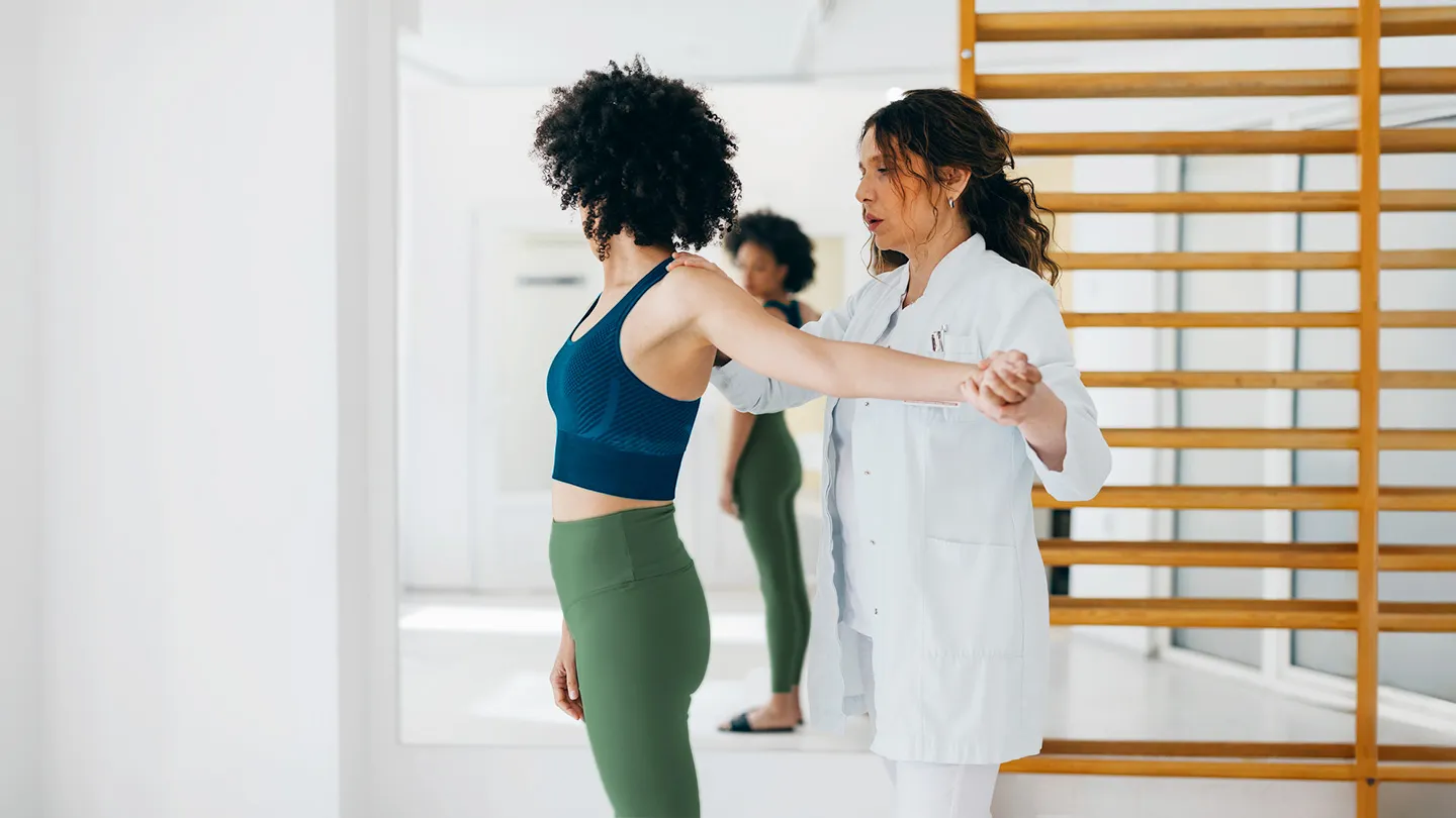 woman receiving upper body physical therapy