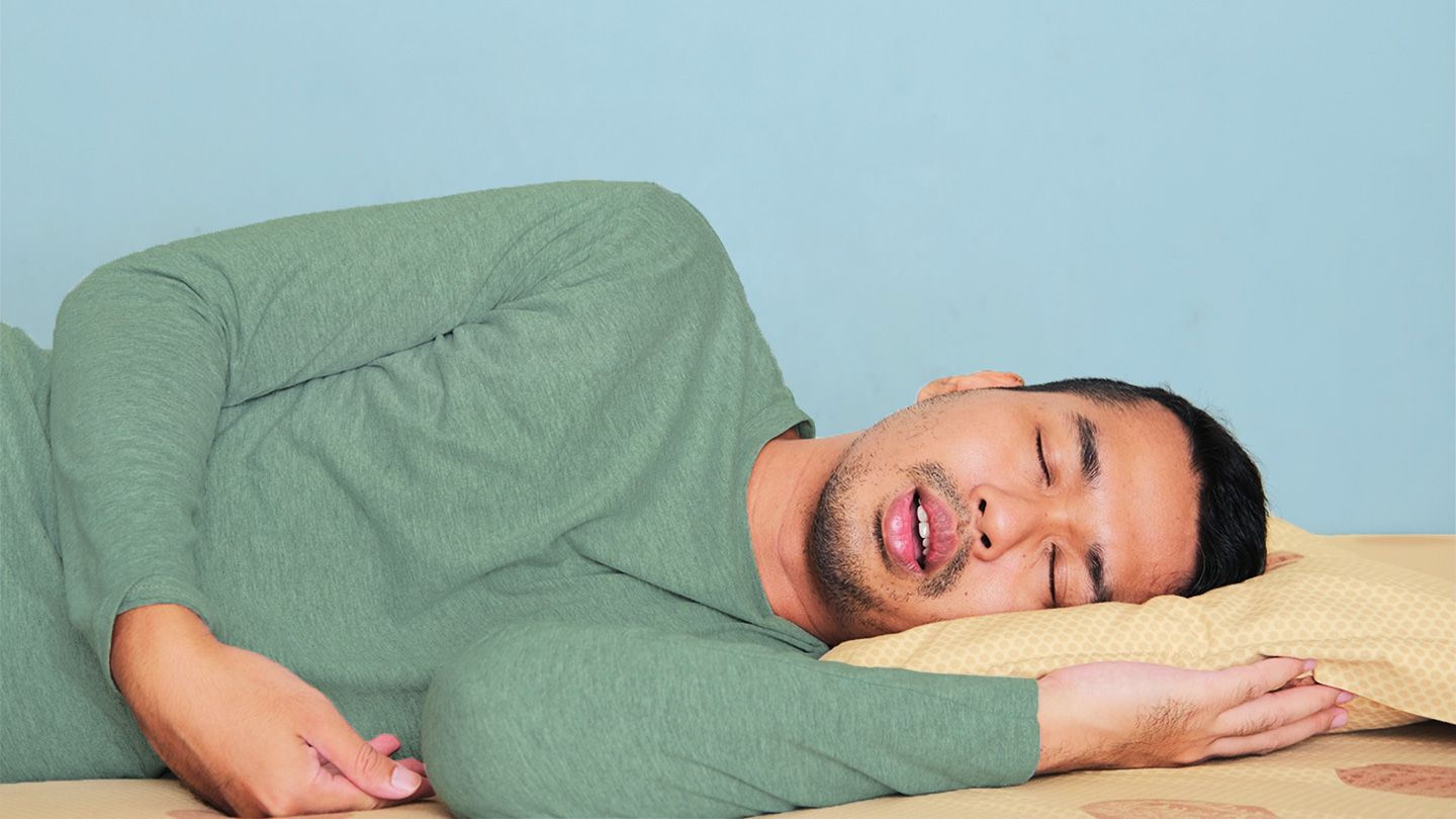 man snoring with mouth open