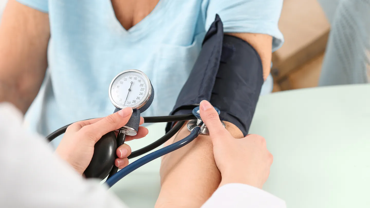mature woman having her blood pressure checked