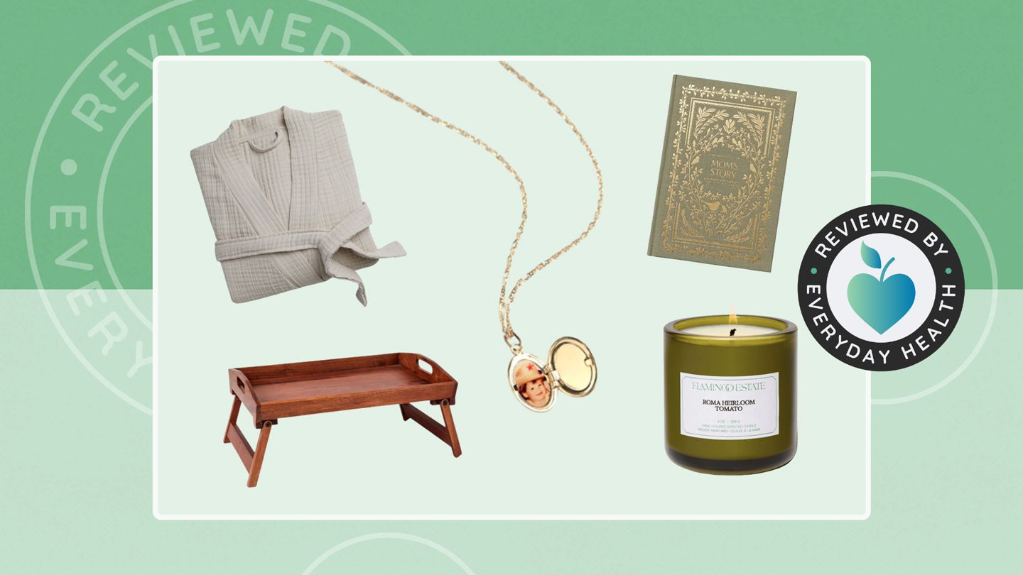 Robe, journal, bedside tray, locket and candle against green background