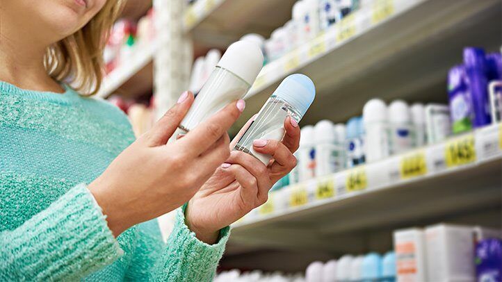 a woman picking out deodorant