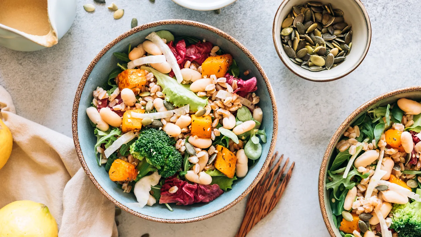 bowl of superfoods vegetables salad beans seeds lemon