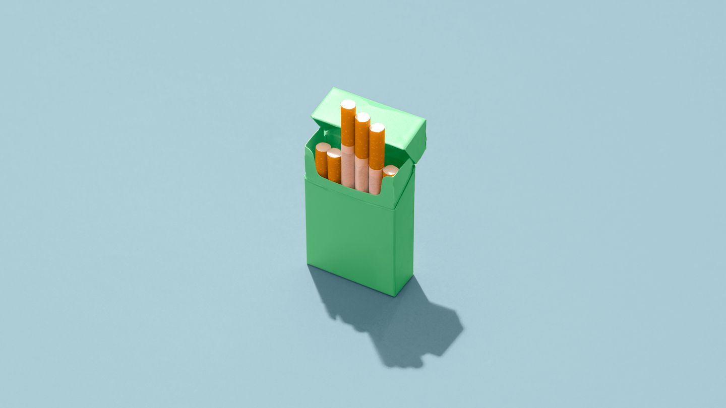 A pack of tobacco cigarettes against blue background