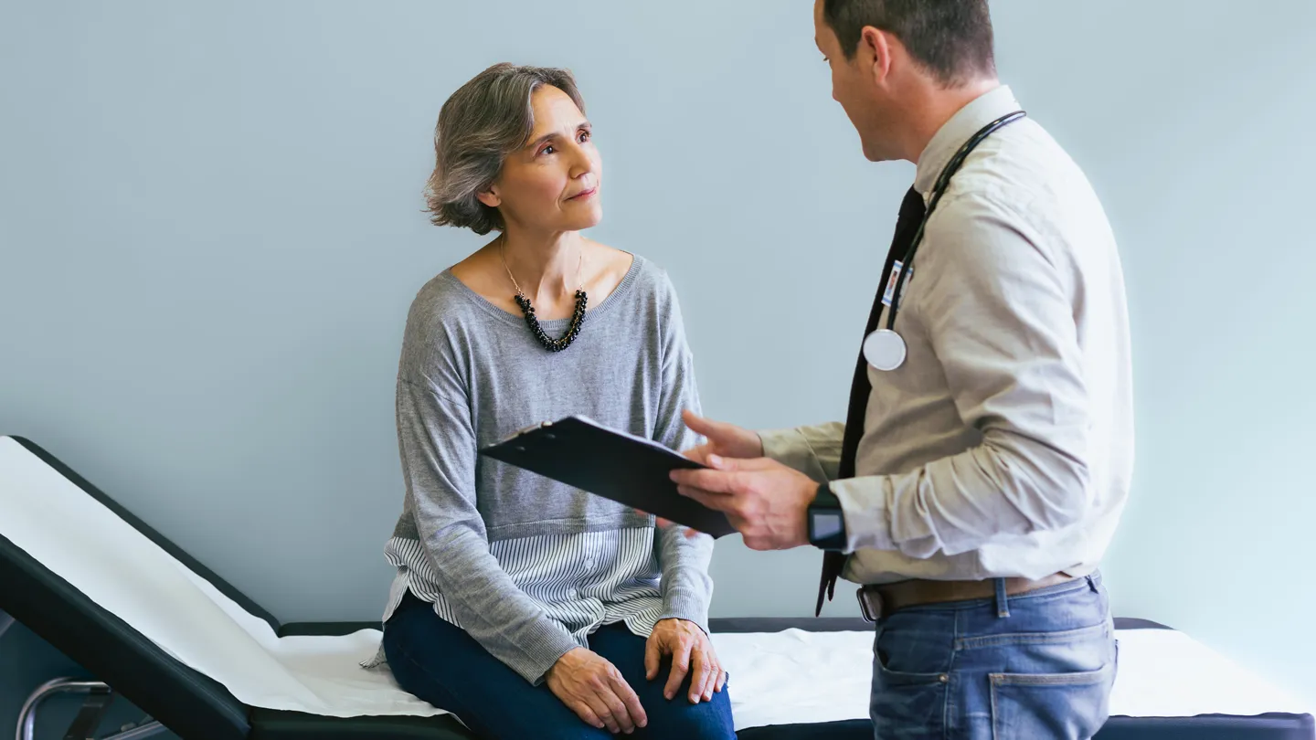woman in her 50s frustrated with her male doctor