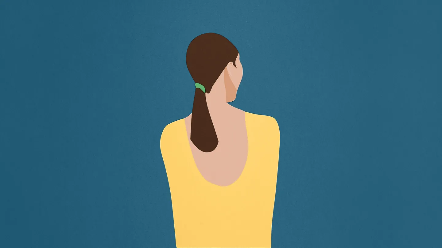 woman surrounded by blue in yellow shirt turned away