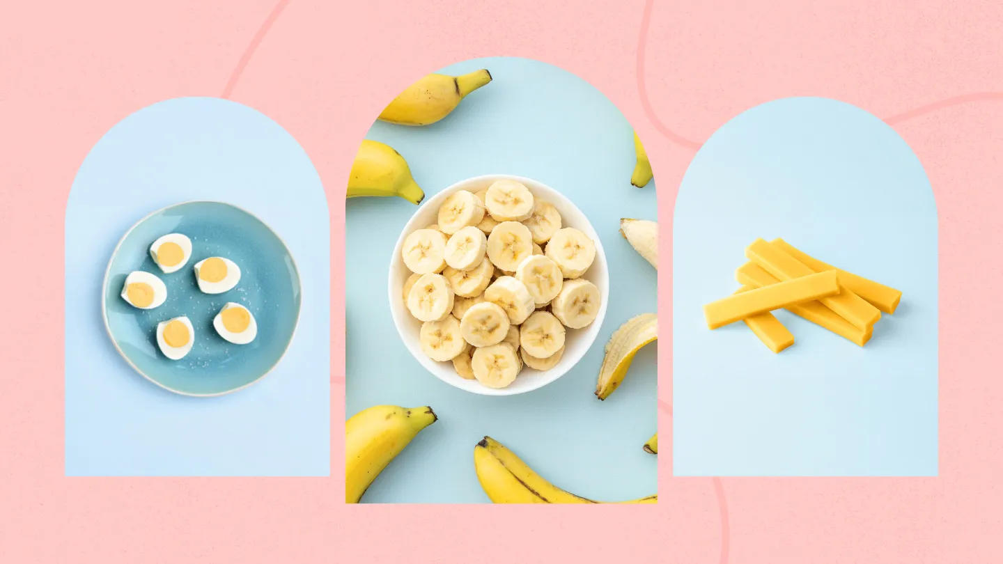 plate with hard boiled eggs bowl of sliced bananas surrounded with full bananas and stacked cheddar cheese sticks