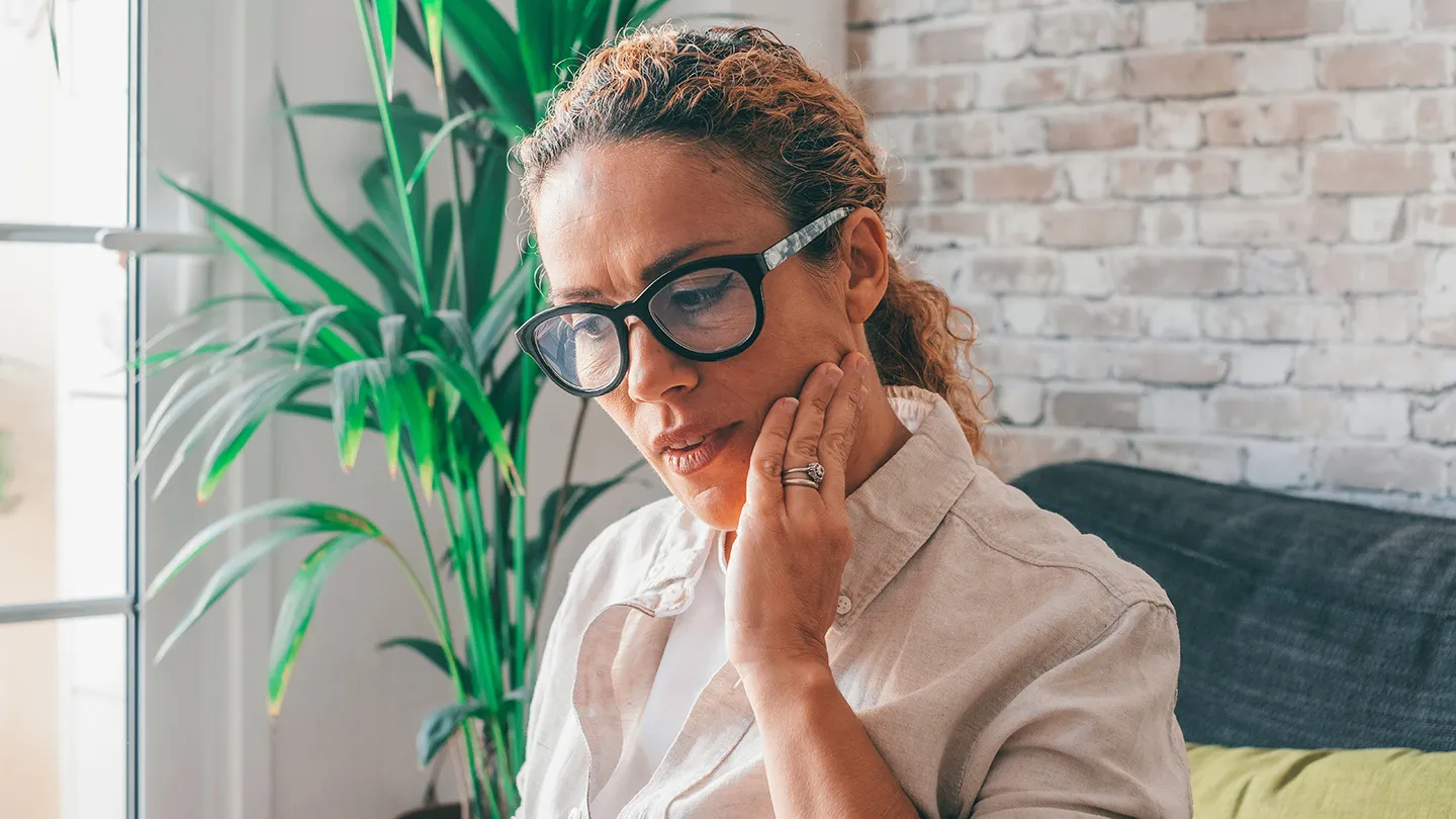 woman with menopausal tmj pain