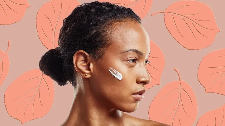 a woman with moisturizer on her face