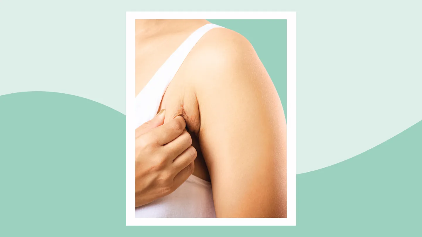 woman scratching her armpit