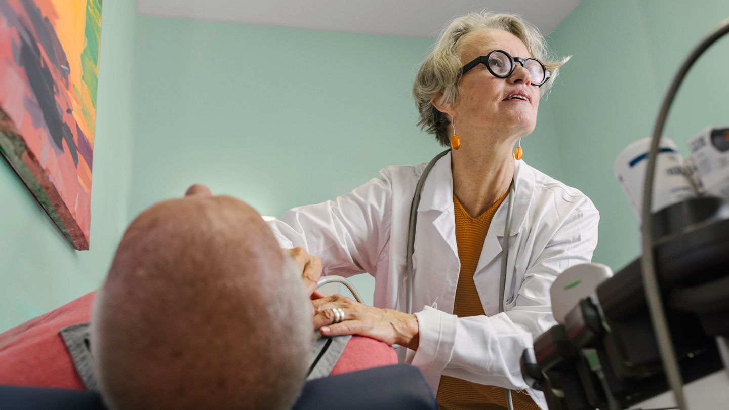 doctor oncologist thyroid ultrasound neck patient