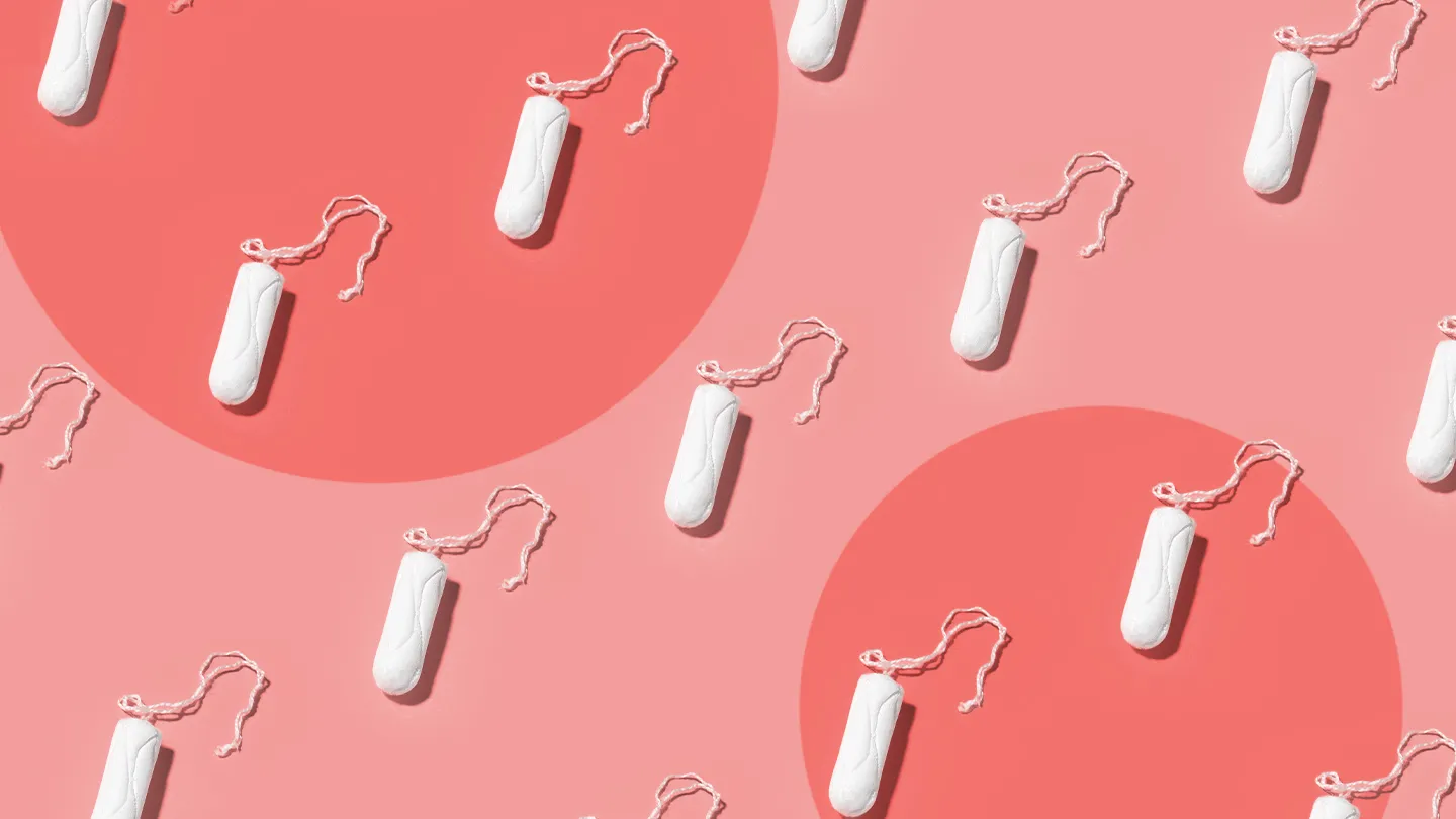 tampons repeating on a coral background with two red circles symbolizing two periods