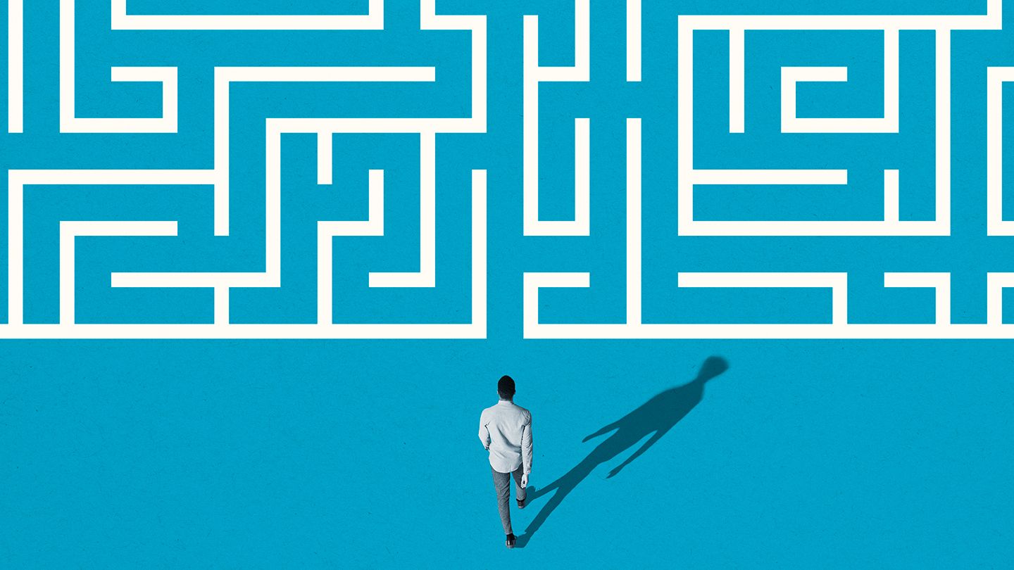 man walking into maze