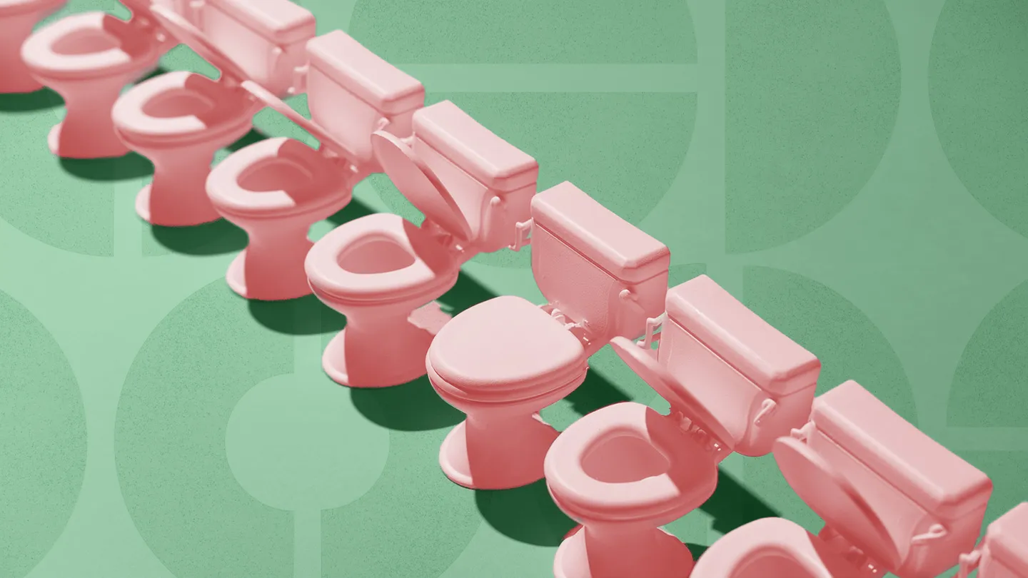 row of coral toilets with varying lids opened on geometric pattern