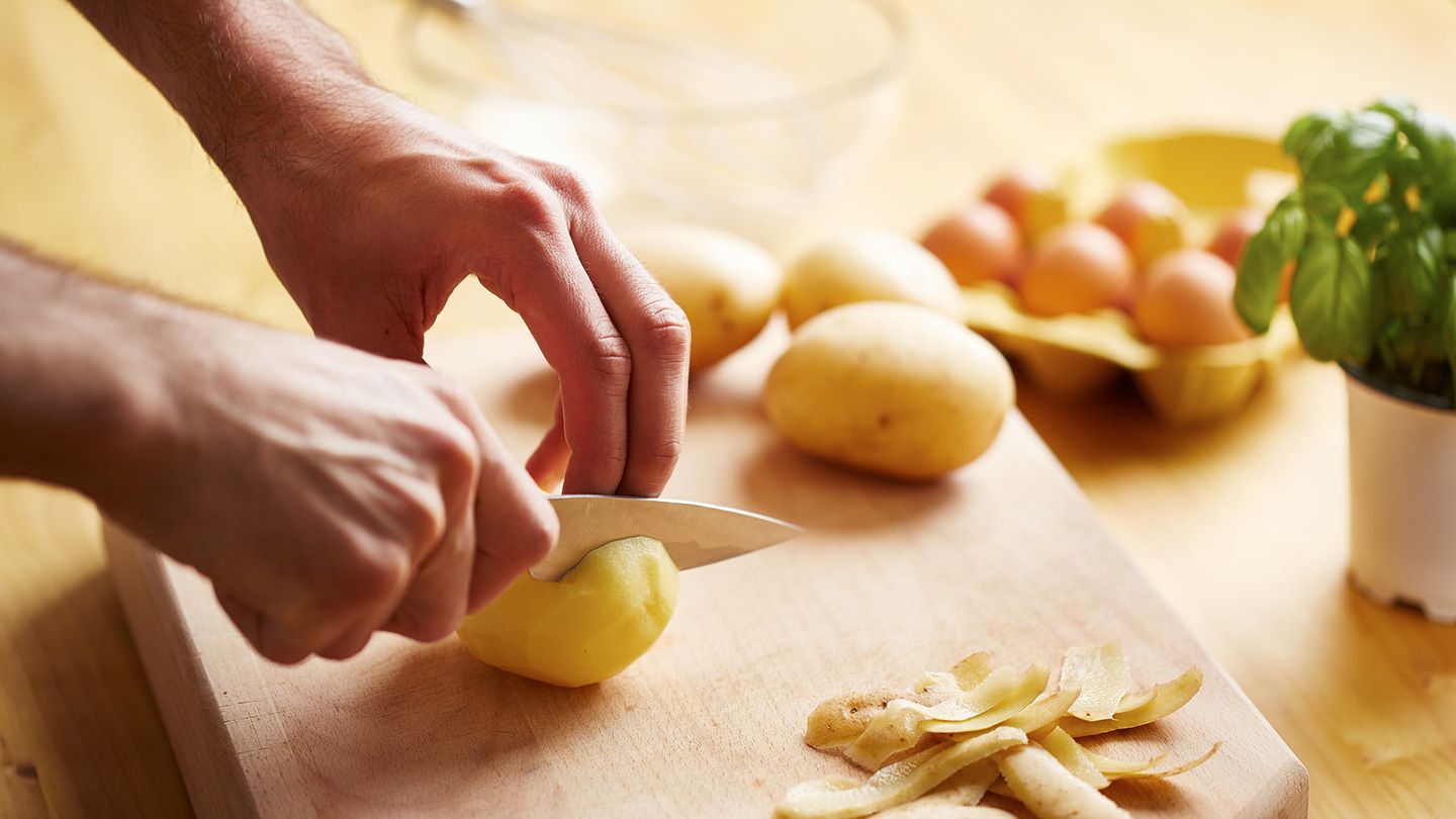 hand cutting Potatoes