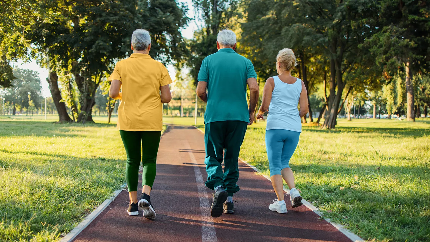 middle aged people jogging