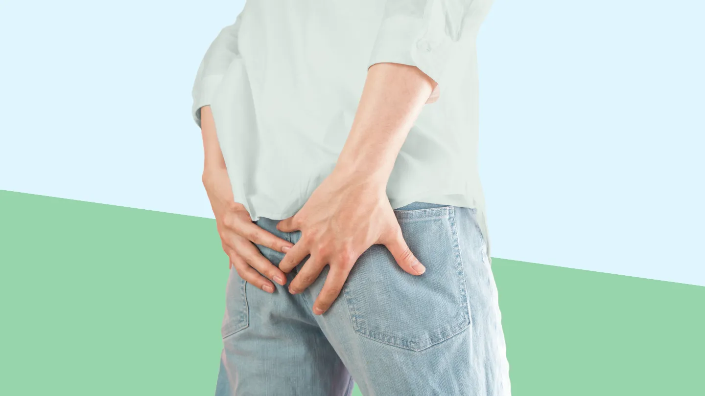 person holding their butt in pain