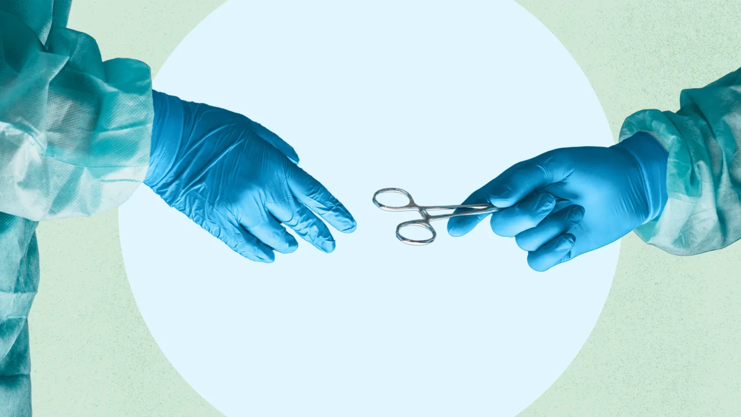 surgeon passing Surgical Scissors to another surgeon