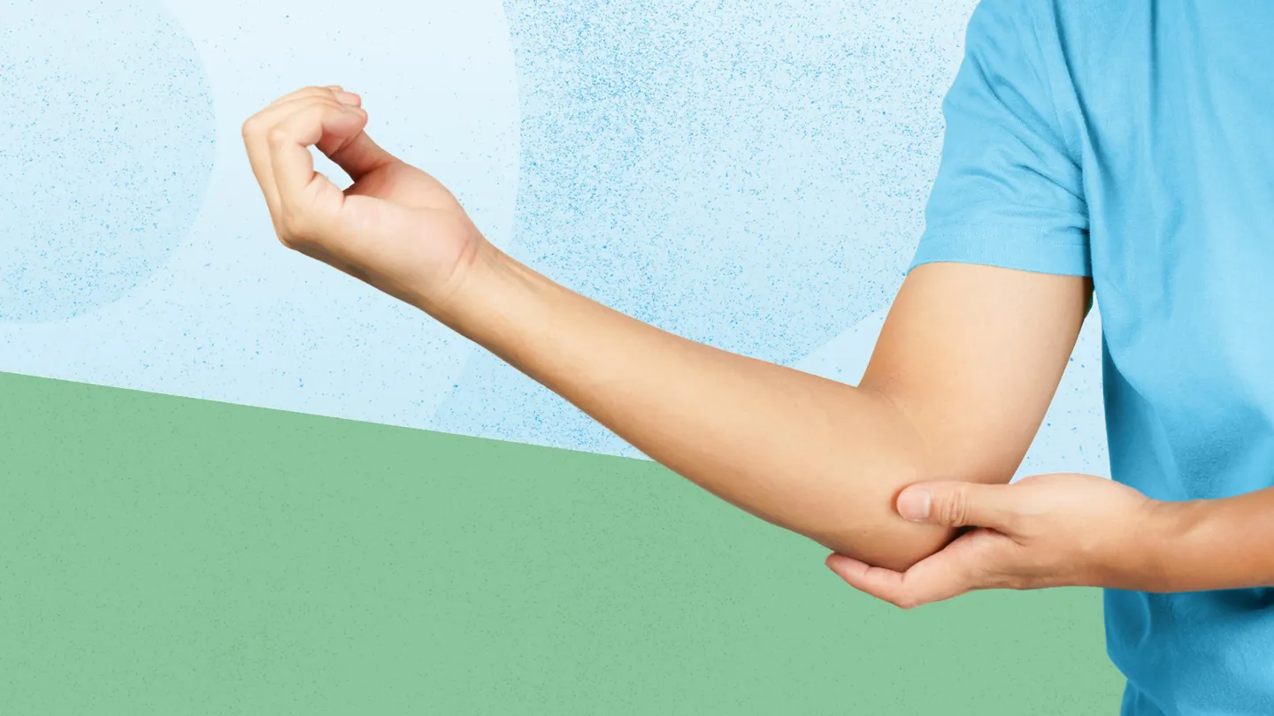 person holding elbow in pain