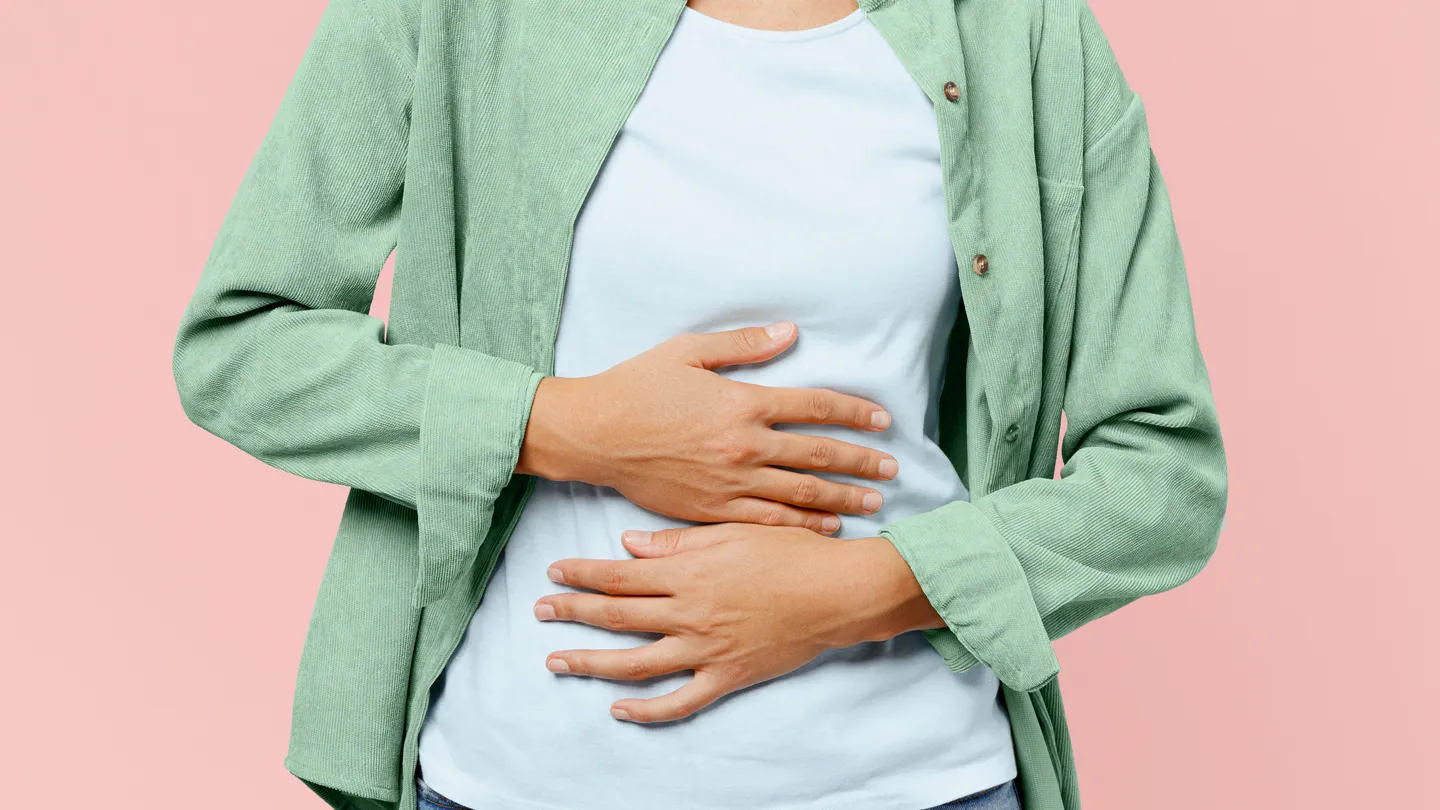 woman touching her abdomen