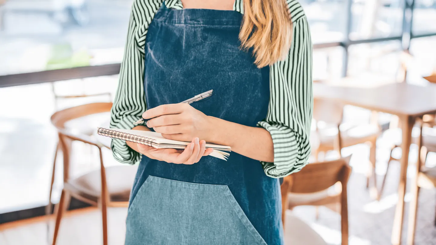 waiter writing down food order