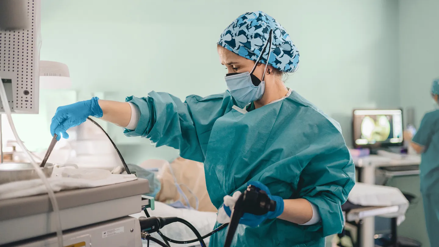 medical team performs a colonoscopy o a patient